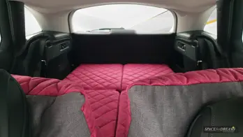 SPACEBED car mattress compactly folded in less than 60 seconds into a custom-made Magic Rosé bag in the trunk.