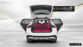 Elegant Magic Rosé transport bag storing the foldable car mattress compactly, taking up hardly any space in the GLC.