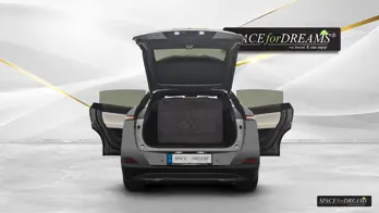 A soft grey Car futon - SPACEBED® is ready for long trips in the Xpeng G6 with the reliable Leveling System S4D.